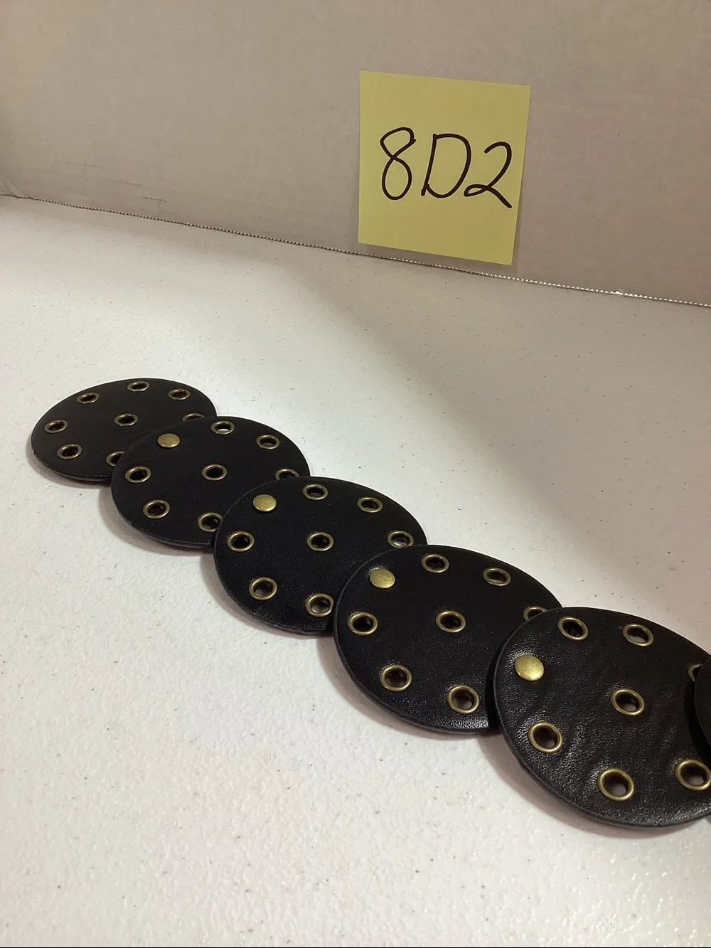 Women’s Black Leather Disc Belt with Brass Medallion